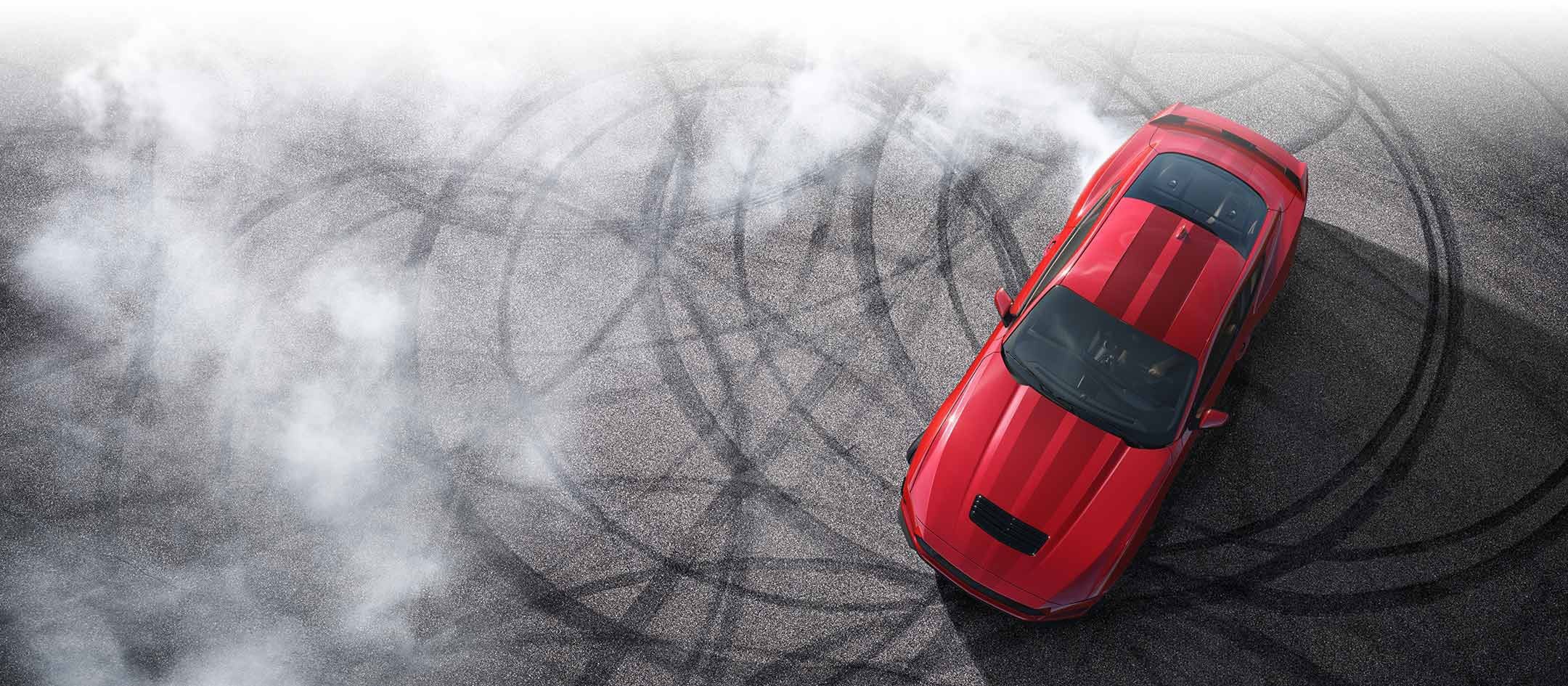 Overhead view of a 2024 Ford Mustang® model with tire tracks on pavement | Ed Morse Ford Red Bud in Red Bud IL