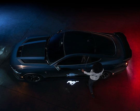 2024 Ford Mustang® Dark Horse™ model with a driver approaching the vehicle | Ed Morse Ford Red Bud in Red Bud IL