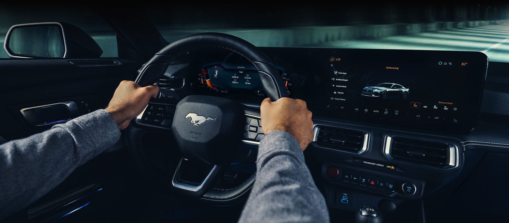 A 2024 Ford Mustang® model interior with a person driving | Ed Morse Ford Red Bud in Red Bud IL